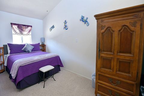 Balcony Bedroom #2 (Gecko) has queen bed with armoire.