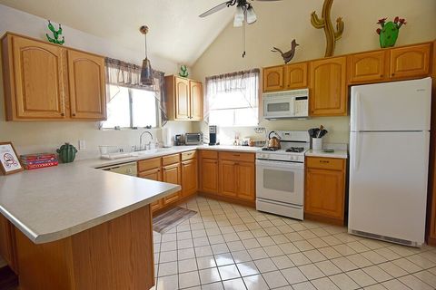 The fun, cactus-themed kitchen is equipped with all dinner and serving ware, utensils, pots and pans, coffee maker, coffee, tea, condiments, etc. Everything you need to whip up a gourmet meal!