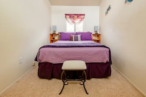 Balcony Bedroom #2 (Gecko) has queen bed, ceiling fan, and nightstands. Lamps have built-in USB ports.