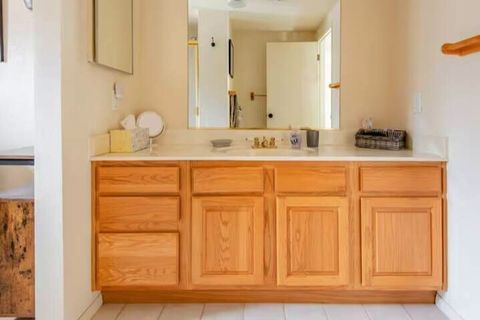 Dedicated bathroom has makeup mirror, hair dryer, and toiletries (if you forgot something).