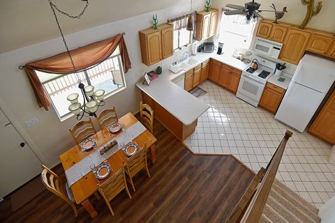 View of Dining Room and Kitchen from balcony.