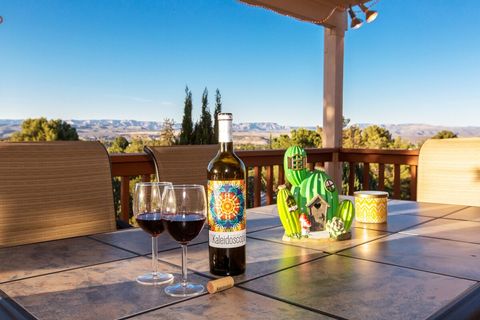 Enjoy a glass of wine on the spacious covered deck. We have amazing views!