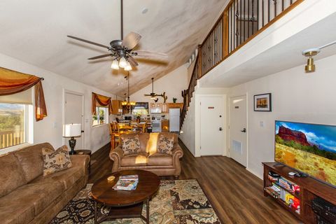 Stream your favorite shows in the cozy living room. Doors under balcony (storage and owners' suite) are not accessible.