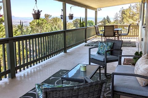 Spacious covered deck runs the length of the house, with gorgeous views on three sides.