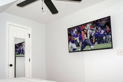 Second-floor bedroom queen bed T.V view