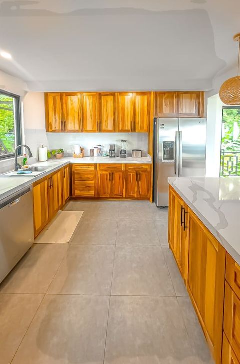 Gourmet Kitchen: Cook up a feast with modern appliances and stunning wood accents!