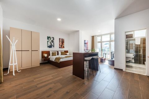 Dining area and bedroom of the studio