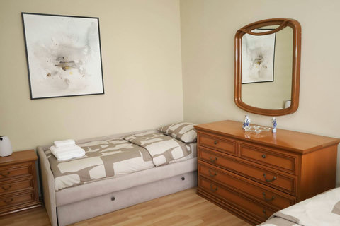 Bedroom with a double bed and a single bed