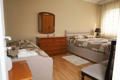 Bedroom with a double bed and a single bed