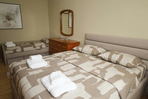 Bedroom with a double bed and a single bed