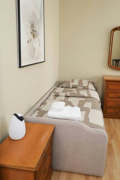 Bedroom with a double bed and a single bed