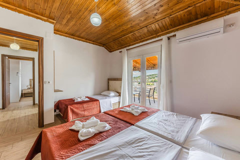 Bedroom 2 with a single bed and a double bed