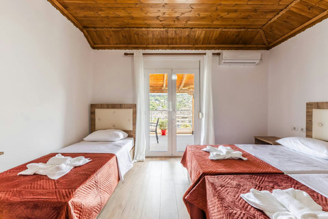 Bedroom 2 with a single bed and a double bed