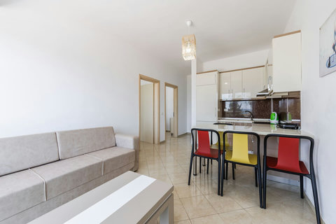 Living room and fully-equipped kitchen