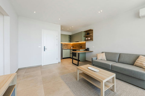 Living room and fully-equipped kitchen