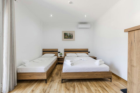 Bedroom with a double and a single bed