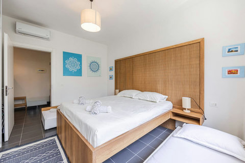 Bedroom with a double and two single beds