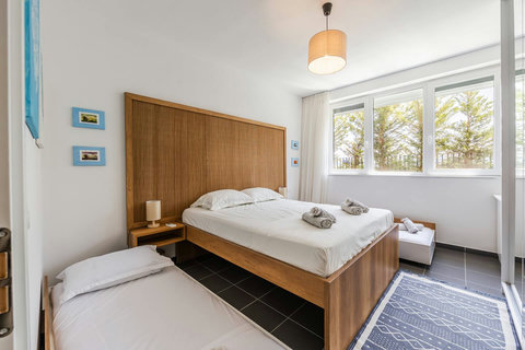 Bedroom with a double and two single beds