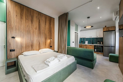 Bedroom with a double bed and living room