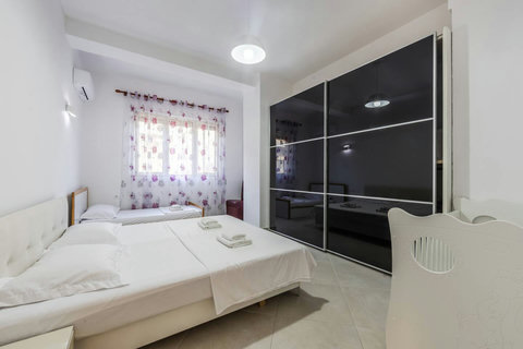 Bedroom 1 with a double and a single bed