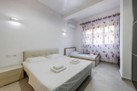 Bedroom 1 with a double and a single bed