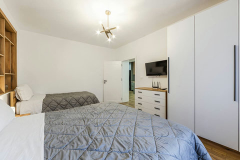 Bedroom with a double and a single bed