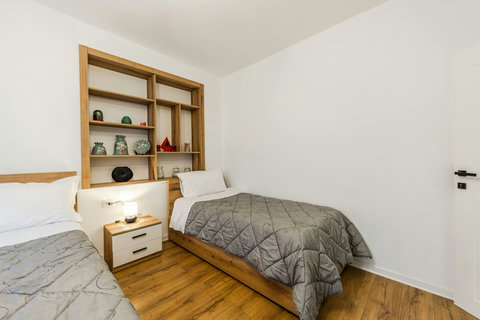 Bedroom with a double and a single bed