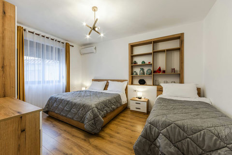 Bedroom with a double and a single bed