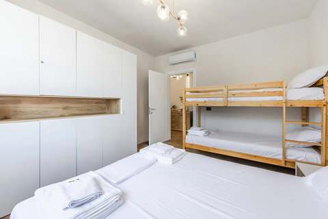 Bedroom with a double and a bunk bed