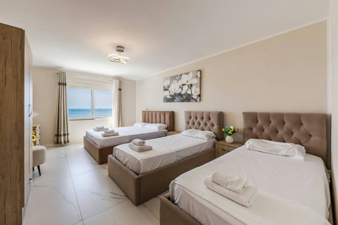 Bedroom with a double and two single beds