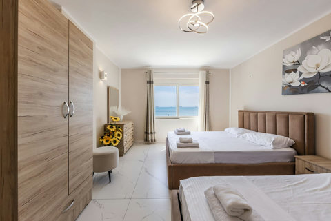 Bedroom with a double and two single beds