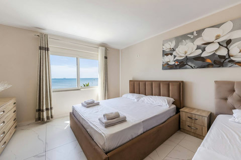 Bedroom with a double and two single beds