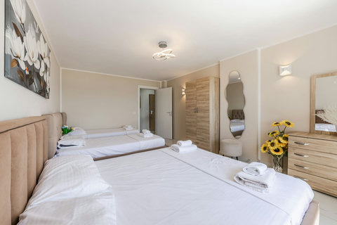 Bedroom with a double and two single beds