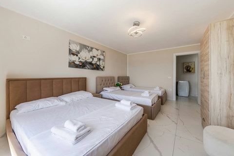 Bedroom with a double and two single beds