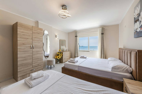 Bedroom with a double and two single beds