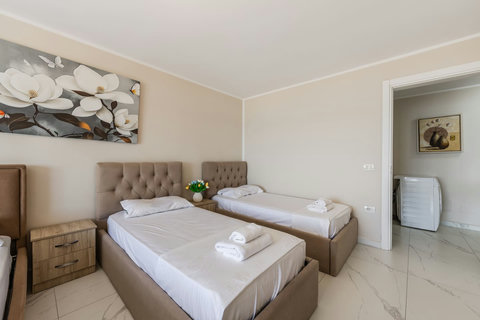 Bedroom with a double and two single beds