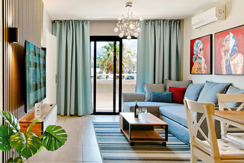 Inviting living space with cozy sofa and entertainment system for unwinding indoors