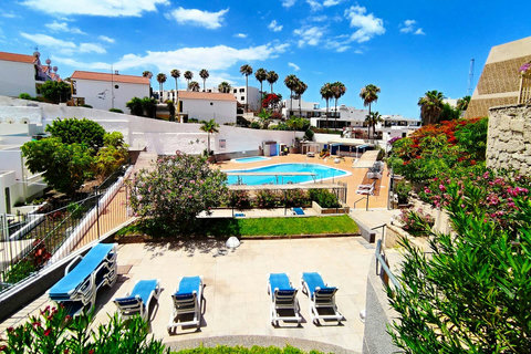 Sparkling pool with sun loungers, perfect for a refreshing dip or relaxing under the sun.