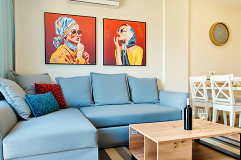 Comfortable lounge with large sofa and high-speed Wi-Fi for streaming and relaxing.
