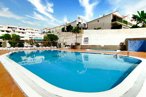 Quiet pool area with loungers and a relaxing atmosphere for a midday break.