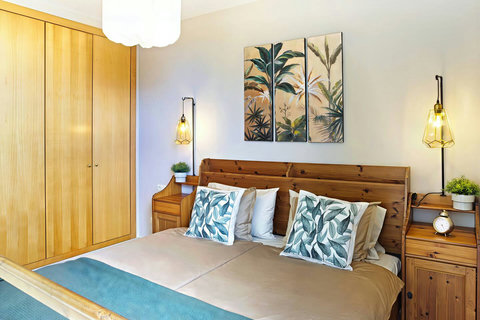 Rest in your Tenerife bedroom with ocean-view balcony.