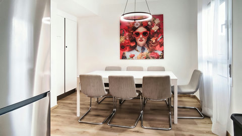 Bright dining room for six with bold art and chic pendant light