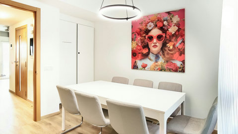 Bright dining for six with ring pendant and bold art—great for meals or work.