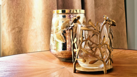 Warm brass accents on sunburst wood—refined, cozy ambiance.