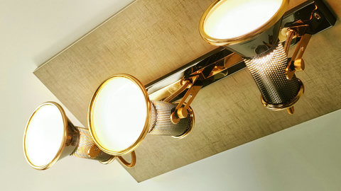 Chic brass spotlight trio adds warm, adjustable mood lighting.