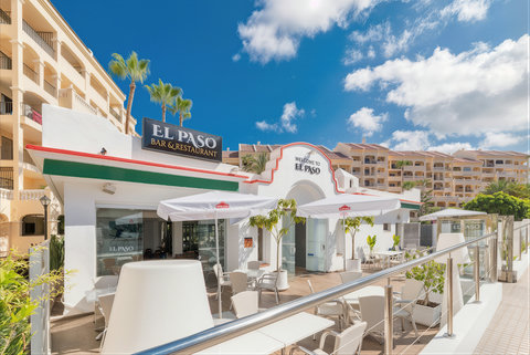 On-site bar & restaurant with sunny terrace seating steps from your stay.