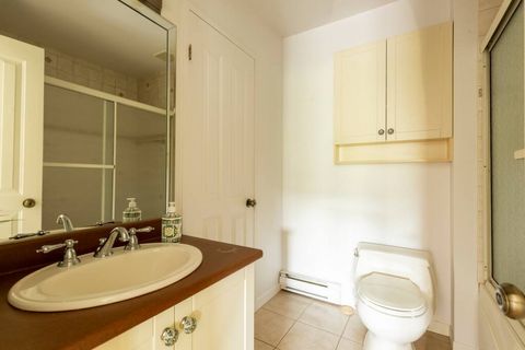 An attached let bath in the master bedroom stocked with cleaning essentials.