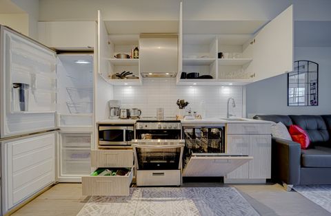 Spacious kitchen with a large fridge and plenty of storage