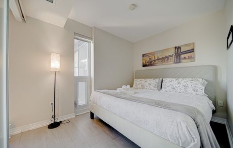 Modern bedroom with a blend of comfort and style.