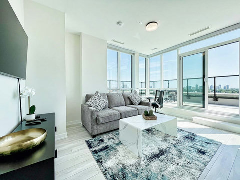 Relax inside or step out—this living room offers both